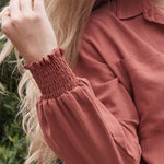 Stay on top of the latest trends in postpartum fashion with the sophisticated ARIA button-up top.