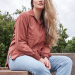 Nursing fashion meets style with the convenient ARIA button-up top for new moms.