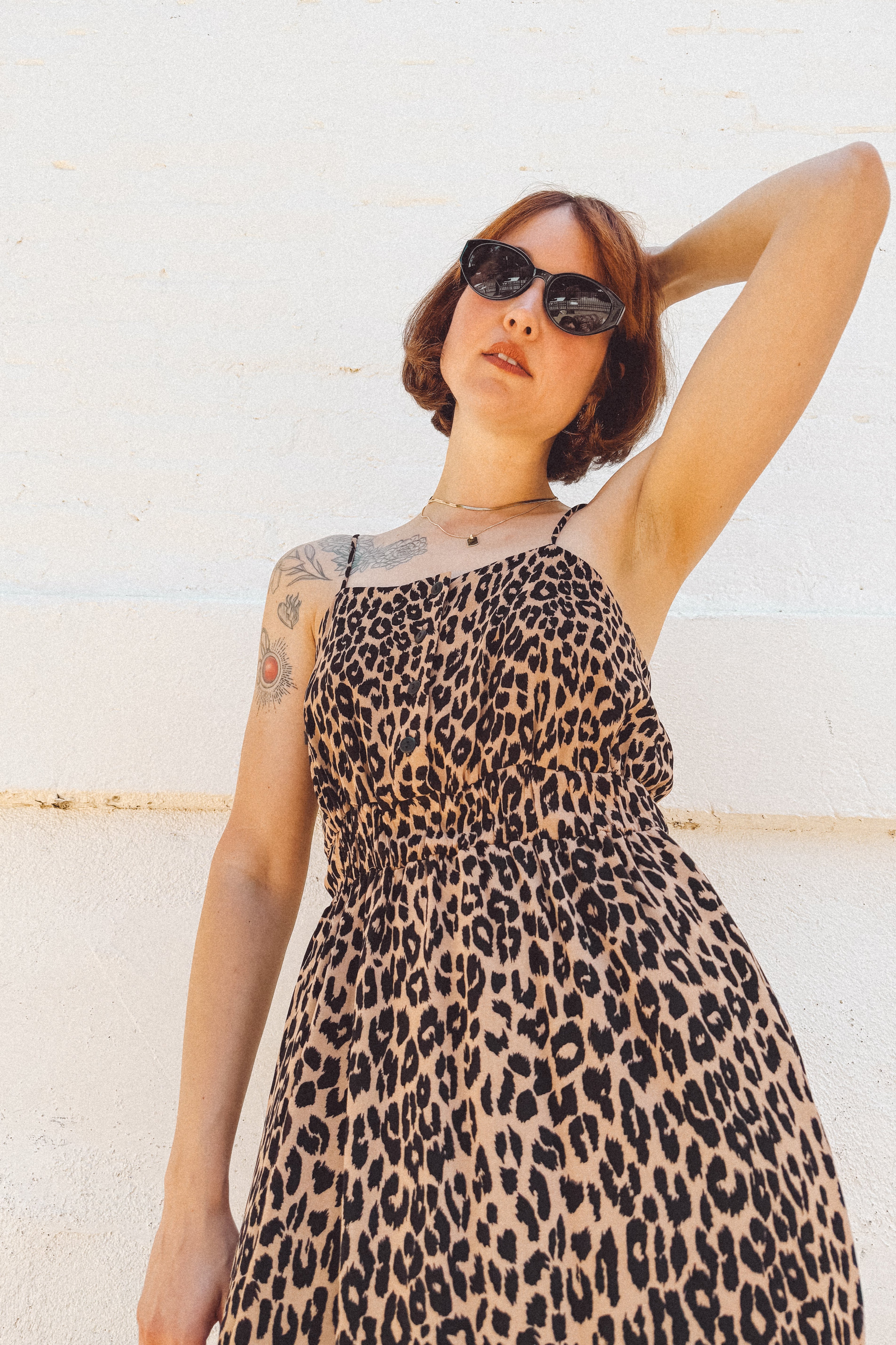 closeup girl wearing leopard button bust elastic waist midid dress 