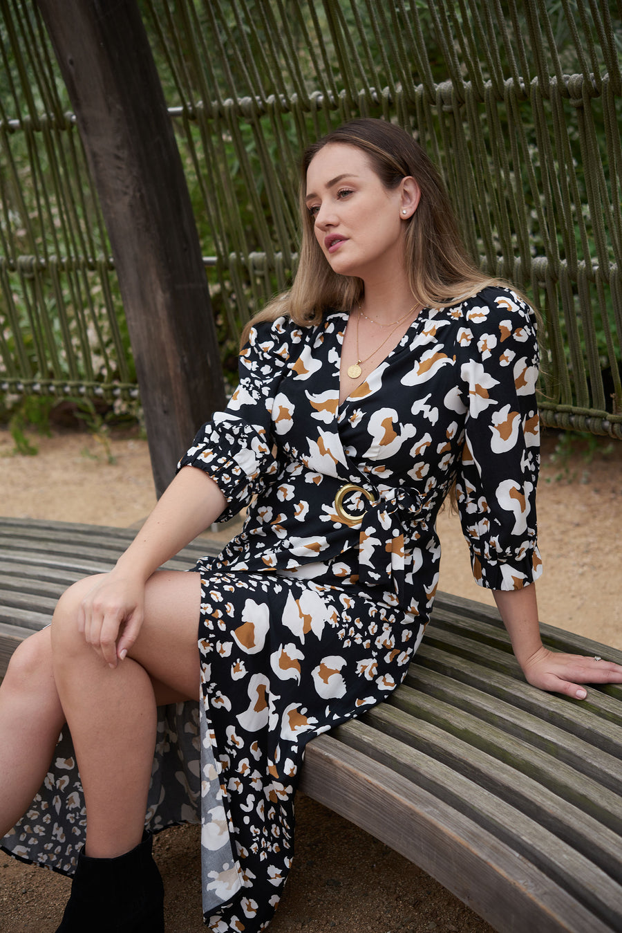 Feel comfortable, confident, and cute in our carefully curated postpartum fashion line, featuring the elegant ANDI adjustable wrap dress.