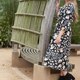 Sustainable fashion for eco-conscious moms: look cute and stay green with the eco-friendly ANDI adjustable wrap dress.