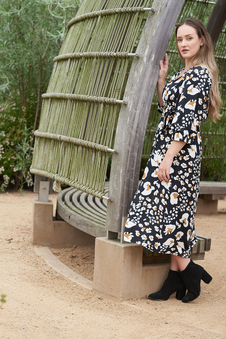 Sustainable fashion for eco-conscious moms: look cute and stay green with the eco-friendly ANDI adjustable wrap dress.
